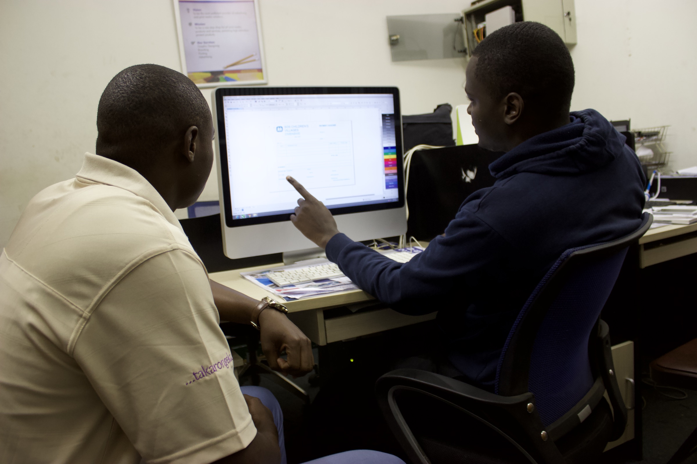 Simply Accounting specialists reviewing business software together