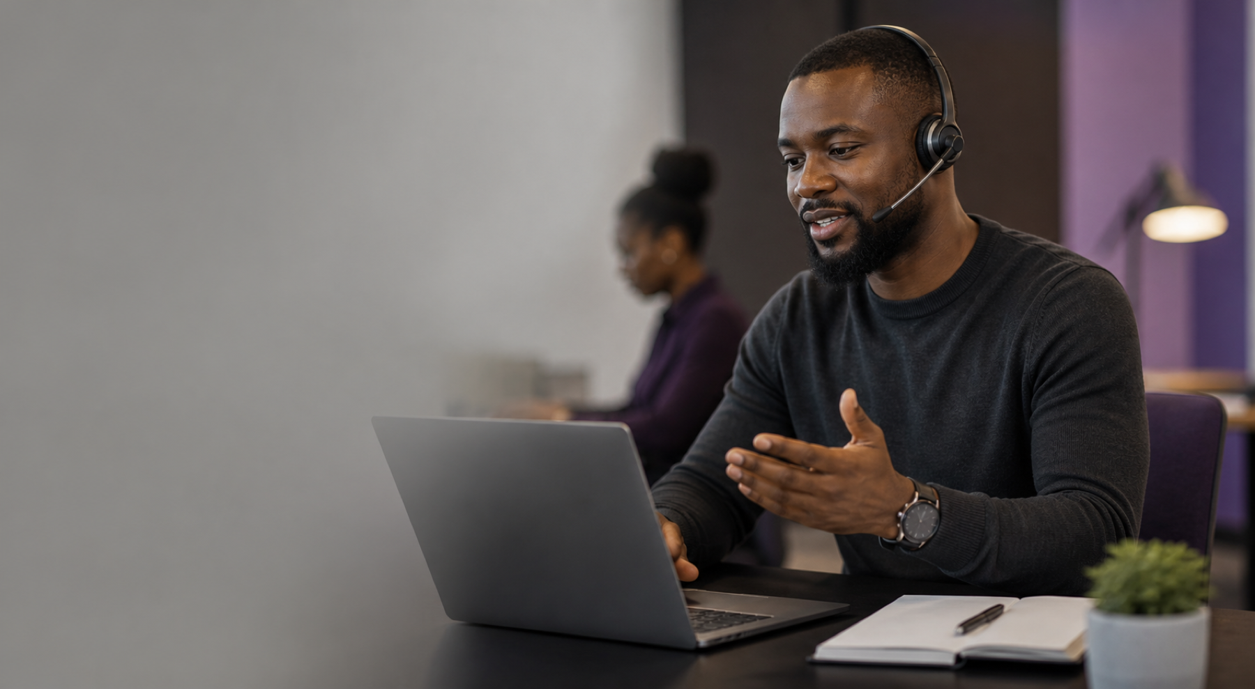 Support consultant helping a customer from a workstation